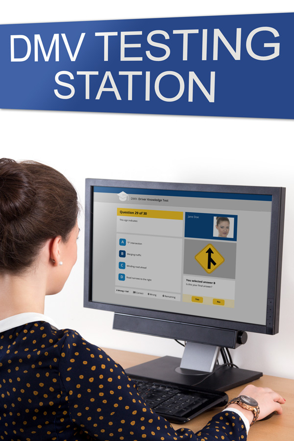 Lady sitting at a DMV Testing Station computer taking a test